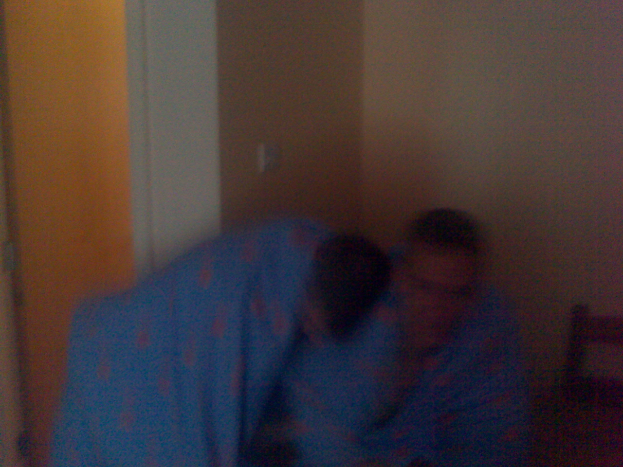 Alex and Crazydave snuggle up under their quilts