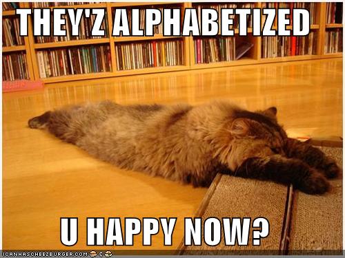 funny-pictures-exhausted-cat-alphabetized-cds