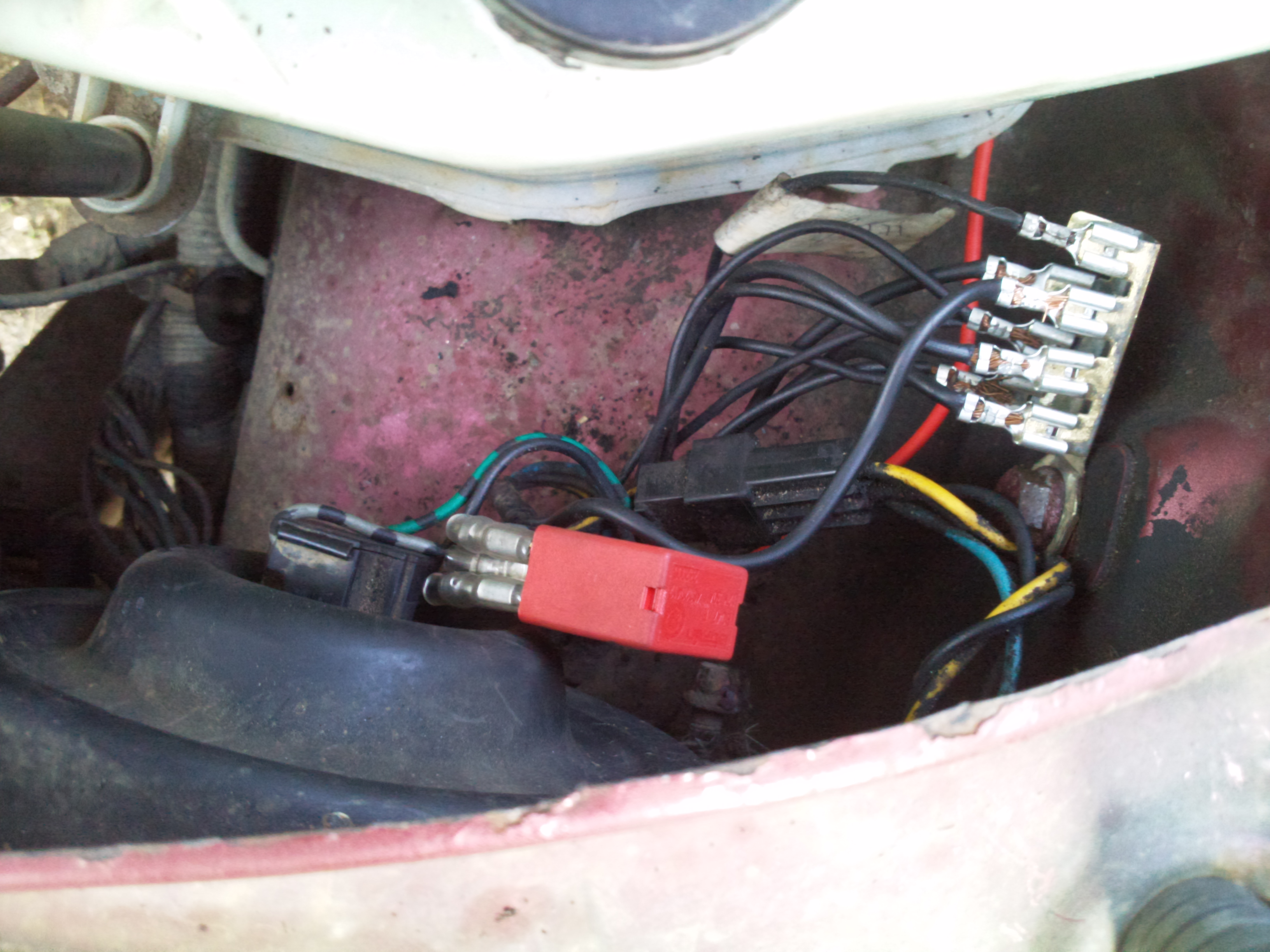 Nearside inner wing/headlight under bonnet